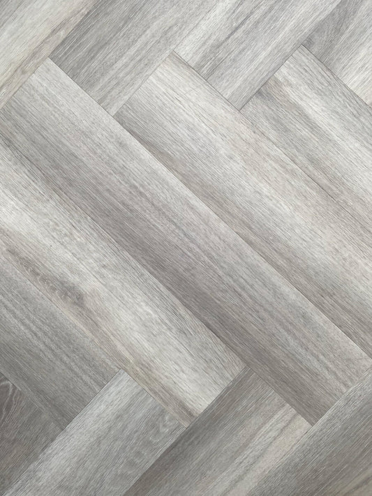 Estate Grey Oak 9MM Herringbone Hybrid Flooring - Obsidian